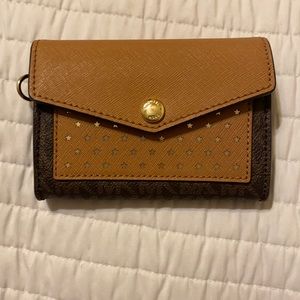 Michael kors brown leather wallet with star print